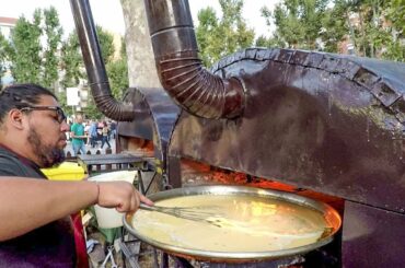 Italy Street Food. Huge Pans and Ovens Cooking 'Farinata', Chickpea Flour Pancake