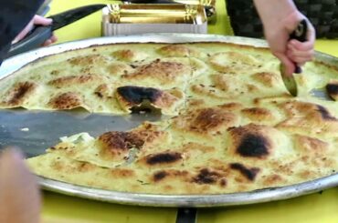 Italy Street Food. Cooking the Farinata Dish. Turin Street Food Parade