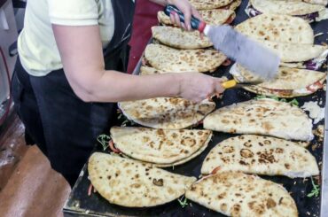 Italian Street Food. Huge Dose of "Spianata" Stuffed Wraps from Bologna