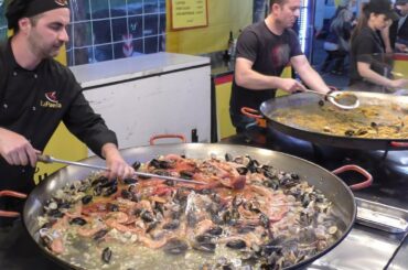 Huge Pans. Cooking Paella Valenciana. Italy Street Food