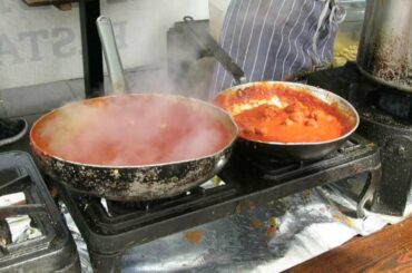 London Street Food. Cooking a Perfect Italian Pasta With Red Pesto