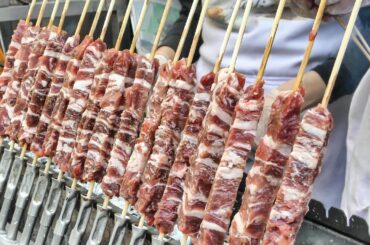 London Street Food from Italy. "Arrosticini" Small Sticks of Sheep Meat Roasted on Charcoal