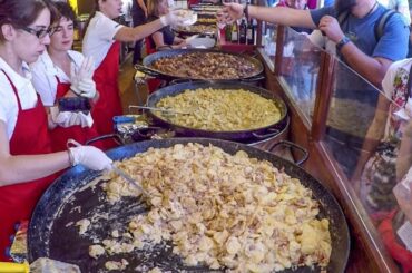 Huge Pans Cooking the Best France Food. Street Food Fair in Italy