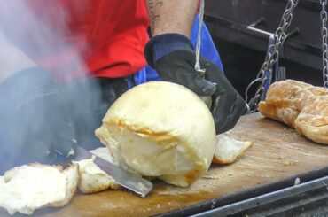 Hanged Cheese 'Caciocavallo' Grilled and Melted on Bread. Italy Street Food