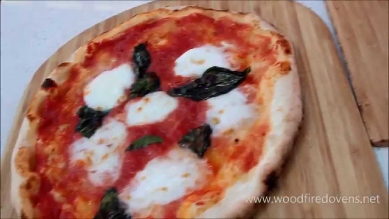 Traditional Italian Wood Fired Pizzas Cooking in the Baby Valoriani Oven Traditional Italian Wood Fired Pizzas Cooking in the Baby Valoriani Oven