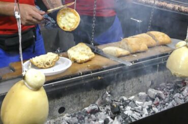 Italy Street Food. Grilling 'Caciocavallo' Cheese, Lamb and Pork Sausages