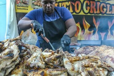 Woman Chef Alone Masters a Huge Grill of Meat. Italy Street Food