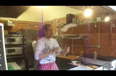 Italian Street Food - a very skilled Pizza Maker (Pizzaiolo) in Camden Stables Market, London.
