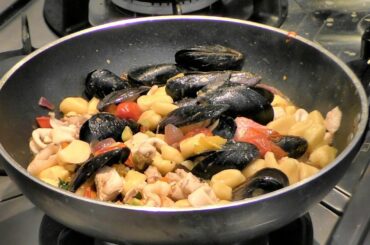 Italian Food Recipes. Gnocchi Dumplings with Ragout of Fish, Seafood and Vegetables
