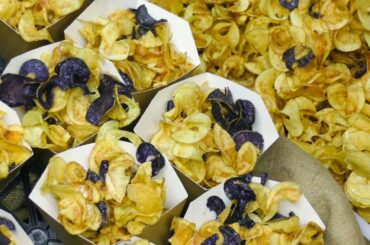 Cutting and Cooking Fried Twisted Chips. Italian Street Food