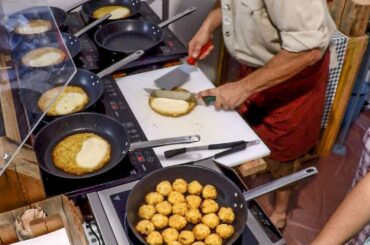 Italy Street Food. Soft Cheese Melted over Potatoes Pancake