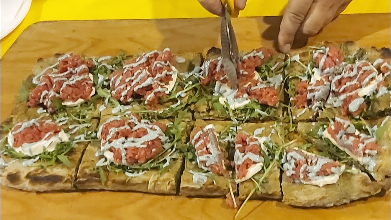 Italy Street Food. Green Pizza with Spirulina Blue-Green Seaweed Italy Street Food. Green Pizza with Spirulina Blue-Green Seaweed