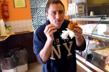 Eating Arancini (delicious food) in Taormina, Sicily Italy