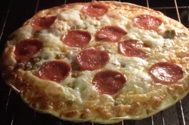 Pizza Cheese Bubbling As Pizza Cooks In 425 Degree Oven
