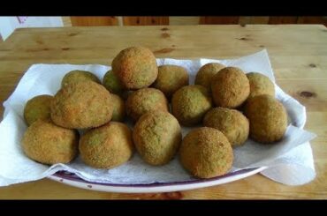 Rice balls   with rocket cream ,parmiggiano and mozzarella easy vegetarian  italian cuisine recipes