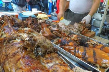 Serbian Masters Roast Huge Dose of Porks and Lambs. Street Food Fair in Italy