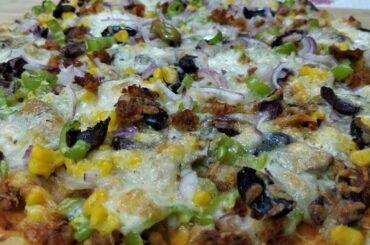 Thin-crust juicy homemade pizza بيتزا