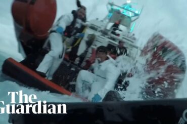 Young child dramatically rescued from capsized migrant boat by Italian coastguard