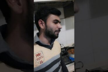 African boy cooking Pakistani food in Italy