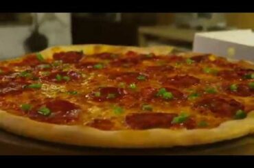 Genuine Italian Pizza cooked in a wood-burning stove