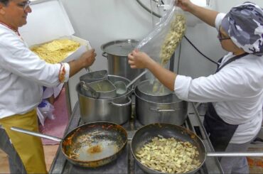 Yummy Italian Pasta and Dumplings with Peppers. Italy Street Food