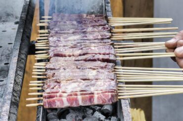 "Arrosticini" Small Sticks of Sheep Meat Roasted on Charcoal. Italy Street food