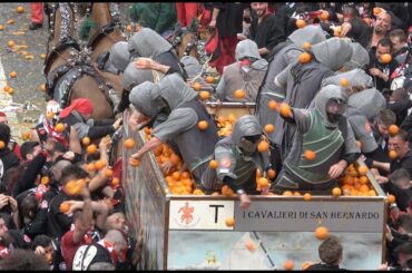 FOOD FIGHT: Thousands gather in Ivrea, Italy to pummel each other with 1.1 million pounds of oranges
