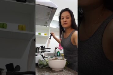 Philipina wife cooking shrimp sinegang