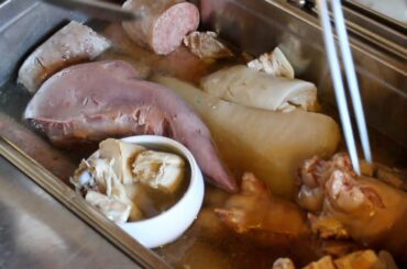 Italian food - Hunter-style local meat dish and wine bottle Christmas tree Mezzocorona Italy