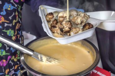 Chicken Wings Drenched in Melted Cheese. London Street Food