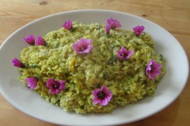 Vegan risotto with flowers and leaves of mallow healthy easy italian recipe