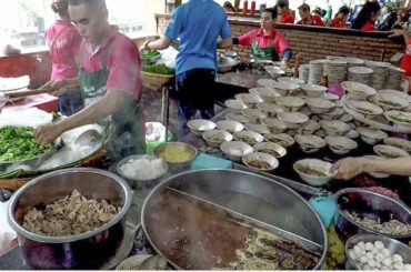 Thailand Street Food. Fast Skills. Noodles Boat in Bangkok, near Victory Square