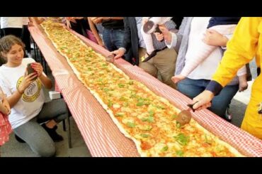 Popular restaurant makes a 100METRE-long pizza