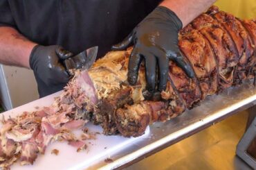 Cutting Huge Pork Belly Roll 'Porchetta' for Yummy Sandwiches. Italy Street Food