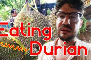 Eating durian for the first time. Smells like feet and garlic.