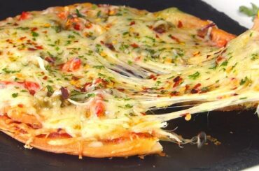 10 minutes Pizza Paratha without Oven / Pan pizza with Frozen Paratha recipe by Tiffin Box