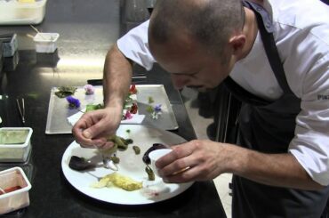 Crippa prepares a dish at Piazza Duomo, Piedmont, Italy