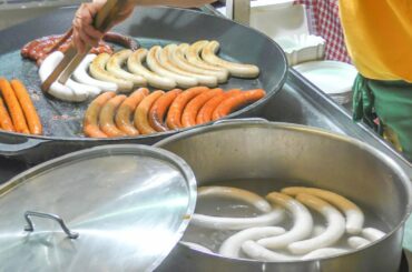 Austria Street Food. Huge Sausages, Meat  and more. Food Fair in Italy