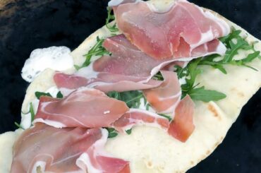 Italian Piadina Wrap Cooked on Charcoal Fire. Street Food from Italy