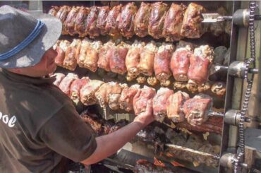 Italian Street Food from Austria. Leg Pork Skewers, Sausages and Burgers on Huge Grills