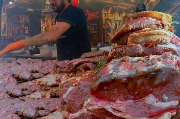 Juicy Pork Loin, Ribs and More Mixed Meat on Huge Grill. Italy Street Food