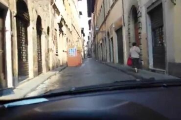 Driving through the old centre of Florence in Italy