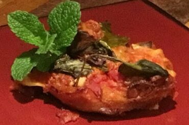 FOOD/ ITALIAN CUISINE EGG PLANT,LASGAMA,chicken, cheese, pomi tamato, veg.