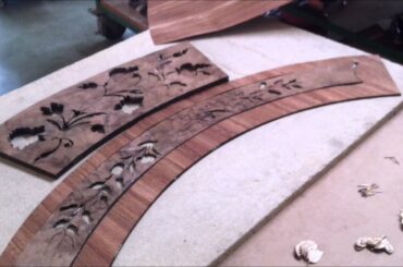 Hand cutting and crafting Italian inlaid wood table top