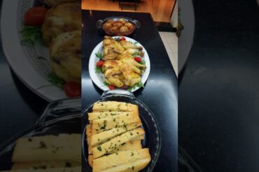 LEMON TARAGON ROASTED CHICKEN, AND KETO GARLIC BREAD SERVE WITH CEASER SALAD ON THE SIDE.