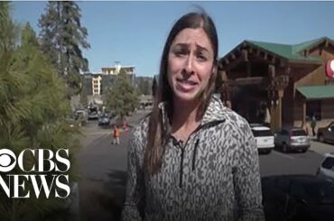 Woman helps elderly couple get food during coronavirus outbreak