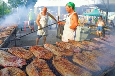 Huge Festival of Pork Ribs and Sausages. North Italy Street Food Event