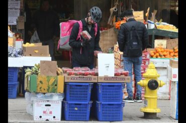BUSINESS AS USUAL: in Chinatown and Little Italy stores and supermarkets