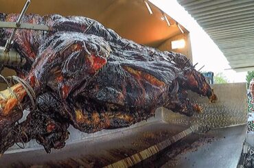 Italian Grill Master Roasts and Cuts WHOLE Bull. Italy Street Food Festival