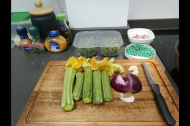 Italian man cooks spätzle with zucchini and bacon
